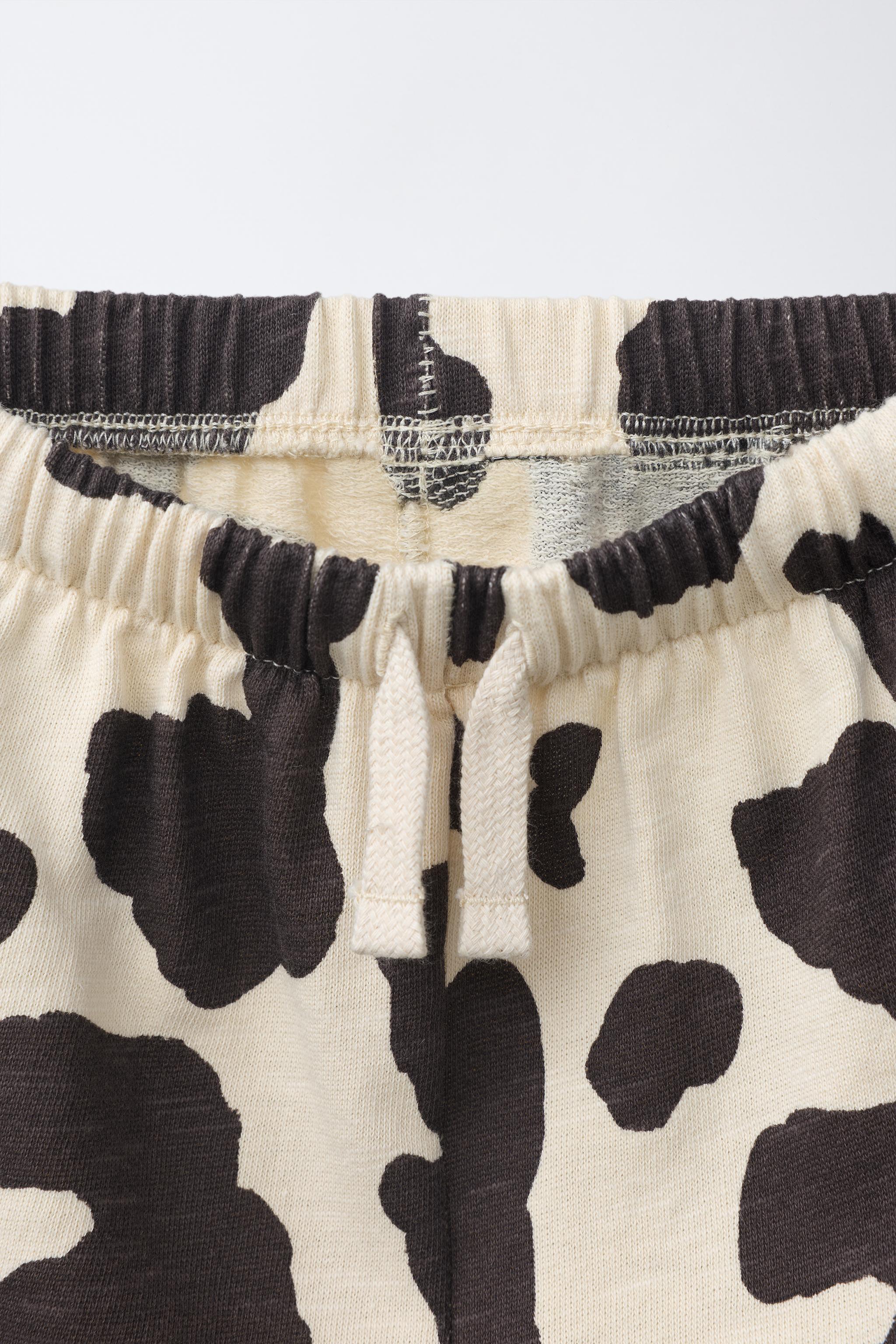 COW PRINT PLUSH SHORTS
